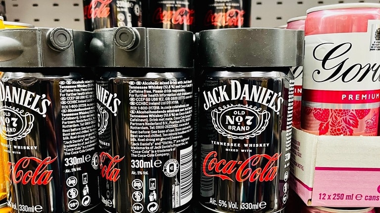 Image showing cans of Jack Daniels with the Coca-Cola logo on them.